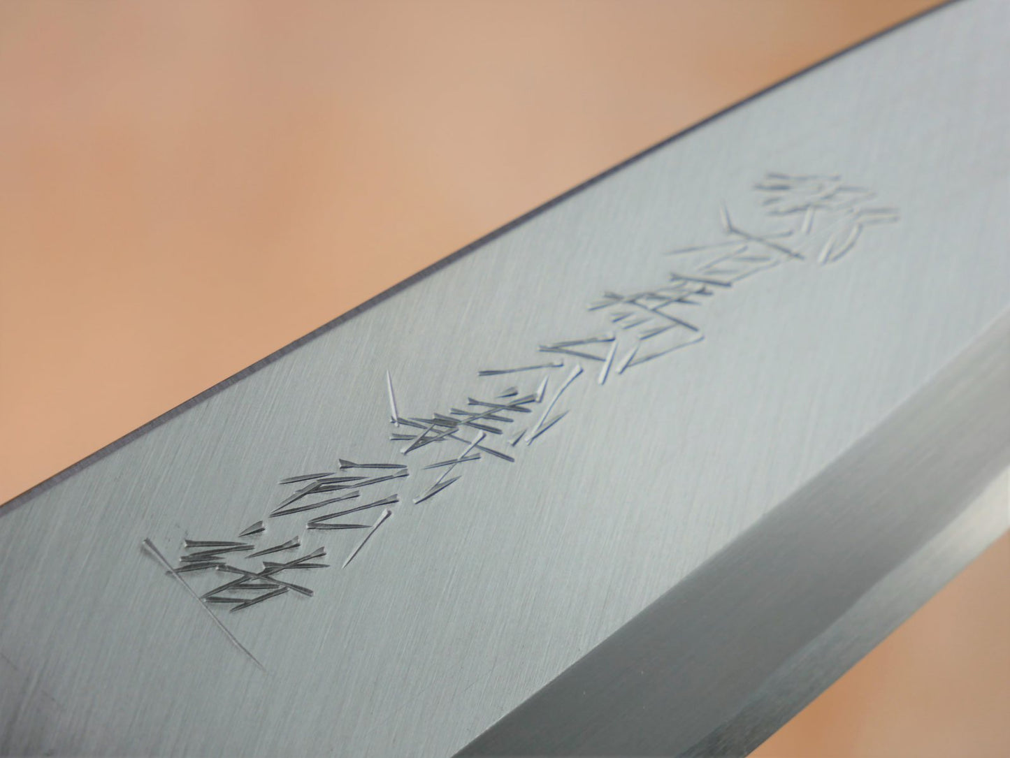 Maker's mark on blade face of 180mm Shirogami Deba made by Yamawaki Hamono